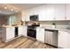 Updated kitchen with modern appliances, white cabinets, and light countertops at 2068 Verbena Nw St, Atlanta, GA 30314