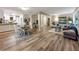 Open-concept living area featuring hardwood floors, a modern kitchen, and comfortable seating at 2068 Verbena Nw St, Atlanta, GA 30314