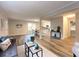 Open concept living room showcasing wood-look floors and seamless transition to kitchen and dining area at 2068 Verbena Nw St, Atlanta, GA 30314