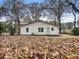 Rear of the home featuring a fenced backyard with mature trees at 2068 Verbena Nw St, Atlanta, GA 30314