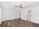 Expansive bedroom showcases hardwood floors, dual closets, and ensuite bathroom at 215 Morris Ln, Woodstock, GA 30188