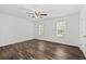 Spacious bedroom with natural light, ceiling fan, and wood-look flooring at 215 Morris Ln, Woodstock, GA 30188