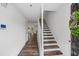 Light-filled entryway features hardwood floors and stairway to the upper level at 215 Morris Ln, Woodstock, GA 30188