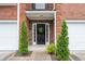 Charming front entryway with well manicured landscaping and stone accents at 215 Morris Ln, Woodstock, GA 30188