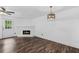Spacious living room with a white brick fireplace and lots of natural light at 215 Morris Ln, Woodstock, GA 30188