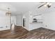 Open-concept living area featuring hardwood floors and an eat in kitchen at 215 Morris Ln, Woodstock, GA 30188