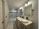 Modern bathroom with double sinks, marble countertops, and glass-enclosed shower at 2610 Stokesley Way, Snellville, GA 30078