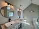Bathroom featuring double vanities, updated lighting, and a modern aesthetic at 2610 Stokesley Way, Snellville, GA 30078