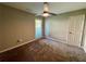Neutral bedroom featuring a ceiling fan, carpeted floor, and natural light from a window at 2610 Stokesley Way, Snellville, GA 30078
