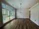 Dining area with large windows and modern chandelier lighting at 2610 Stokesley Way, Snellville, GA 30078