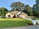 Charming single-story home featuring a manicured lawn, modern garage door, and circular window at 2610 Stokesley Way, Snellville, GA 30078