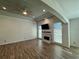 Bright living room showcasing a tray ceiling, fireplace, and large windows at 2610 Stokesley Way, Snellville, GA 30078