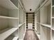 Walk-in closet with ample storage space and shelving at 2610 Stokesley Way, Snellville, GA 30078
