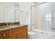 Updated bathroom with granite countertops, wooden vanity, and a glass enclosed shower at 2828 Peachtree Nw Rd # 2002, Atlanta, GA 30305