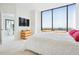 Modern bedroom featuring floor-to-ceiling windows with skyline views at 2828 Peachtree Nw Rd # 2002, Atlanta, GA 30305