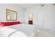 Spacious primary bedroom with a large mirror and access to the ensuite bath at 2828 Peachtree Nw Rd # 2002, Atlanta, GA 30305