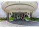 Welcoming building entrance with elegant planters, paving and lush plants, setting a sophisticated tone at 2828 Peachtree Nw Rd # 2002, Atlanta, GA 30305