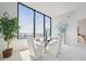 Dining room with floor to ceiling windows and modern decor with a view of the city at 2828 Peachtree Nw Rd # 2002, Atlanta, GA 30305