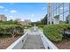 Beautifully landscaped garden with elegant fountain and green plants creates a serene outdoor retreat at 2828 Peachtree Nw Rd # 2002, Atlanta, GA 30305