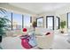 Bright living room with large windows and modern decor with a colorful rug at 2828 Peachtree Nw Rd # 2002, Atlanta, GA 30305