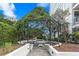 Charming outdoor seating area with climbing plants providing a peaceful spot for relaxation and gatherings at 2828 Peachtree Nw Rd # 2002, Atlanta, GA 30305