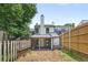 Backyard featuring a partial fence and covered patio, perfect for relaxing or entertaining outdoors at 3072 Revere Ct, Atlanta, GA 30340