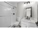 Bathroom featuring new vanity with stone countertop, shower with glass doors, and updated fixtures at 3072 Revere Ct, Atlanta, GA 30340