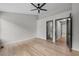 This bedroom boasts wood-look floors, a modern ceiling fan, and neutral paint, creating a serene atmosphere at 3072 Revere Ct, Atlanta, GA 30340