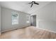 Bright bedroom with wood floors, vaulted ceiling, ceiling fan and two bright windows at 3072 Revere Ct, Atlanta, GA 30340