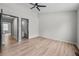 Spacious bedroom with wood floors and views into bathroom at 3072 Revere Ct, Atlanta, GA 30340