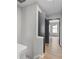 Bright hallway featuring wood floors, modern trim, and a neutral color palette at 3072 Revere Ct, Atlanta, GA 30340