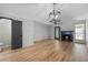 Bright living room featuring luxury vinyl flooring, a ceiling fan and fireplace at 3072 Revere Ct, Atlanta, GA 30340