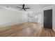 Spacious living room with wood floors and a modern ceiling fan light fixture at 3072 Revere Ct, Atlanta, GA 30340