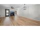 Bright living room featuring luxury vinyl flooring, a ceiling fan and fireplace at 3072 Revere Ct, Atlanta, GA 30340