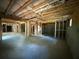 Large unfinished basement space with concrete flooring and exposed ceiling at 4110 Post Gate Ct, Cumming, GA 30040