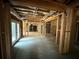 Unfinished basement with framing, piping, and a door to the outside at 4110 Post Gate Ct, Cumming, GA 30040