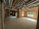 Unfinished basement with concrete floor, framed walls, and natural light at 4110 Post Gate Ct, Cumming, GA 30040