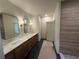 Spacious bathroom with dual sinks, marble countertop, tile floors, shower, and modern lighting at 4110 Post Gate Ct, Cumming, GA 30040