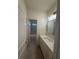 Modern bathroom featuring white cabinets, a large mirror, and neutral finishes at 4110 Post Gate Ct, Cumming, GA 30040