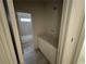 Bathroom featuring a vanity with white cabinets and a tub at 4110 Post Gate Ct, Cumming, GA 30040