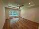 Spacious bedroom featuring hardwood floors, recessed lighting, ceiling fan, and a window at 4110 Post Gate Ct, Cumming, GA 30040