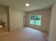 Cozy bedroom with a window providing a view of the outdoors at 4110 Post Gate Ct, Cumming, GA 30040
