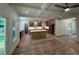 Open kitchen with an island, coffered ceilings, stainless appliances, and a seamless connection to outdoor spaces at 4110 Post Gate Ct, Cumming, GA 30040