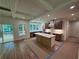 Modern kitchen with an island, stainless steel appliances, and hardwood floors, perfect for cooking and entertaining at 4110 Post Gate Ct, Cumming, GA 30040
