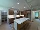 Gourmet kitchen with a large island, custom cabinets, and modern appliances, ideal for culinary enthusiasts at 4110 Post Gate Ct, Cumming, GA 30040