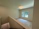 Bright loft area featuring a window with natural light and neutral color scheme at 4110 Post Gate Ct, Cumming, GA 30040