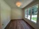 Bright office space with hardwood floors and a large window offering natural light and outdoor views at 4110 Post Gate Ct, Cumming, GA 30040