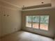 A cozy room featuring a large window that floods the space with natural light at 4110 Post Gate Ct, Cumming, GA 30040