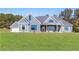 Detailed view of a modern home with gray siding and manicured lawn at 101 Red Oak Ln, Carrollton, GA 30116