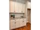 Kitchen with marble counters, white cabinets, and stainless appliances offers style and function at 101 Red Oak Ln, Carrollton, GA 30116
